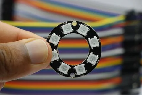 LED ring with individually addressable LEDs held in the hand Stock Photos