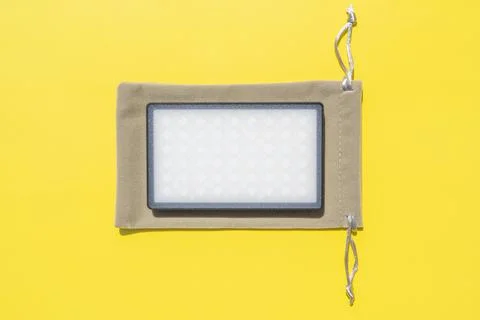 Led screen portable macro texture isolated on yellow background. Art design r Foto stock