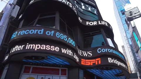 LED Sign in Times Square NYC with Coronavirus Covid-19 warning Stock Footage