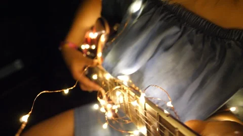 Led String Lights Garland Wrapped on Electric Guitar Strings, Dreamlike Stock Footage 125858261