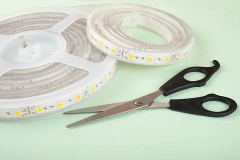 Led strip and scissors for installing decorative light Stock Photos