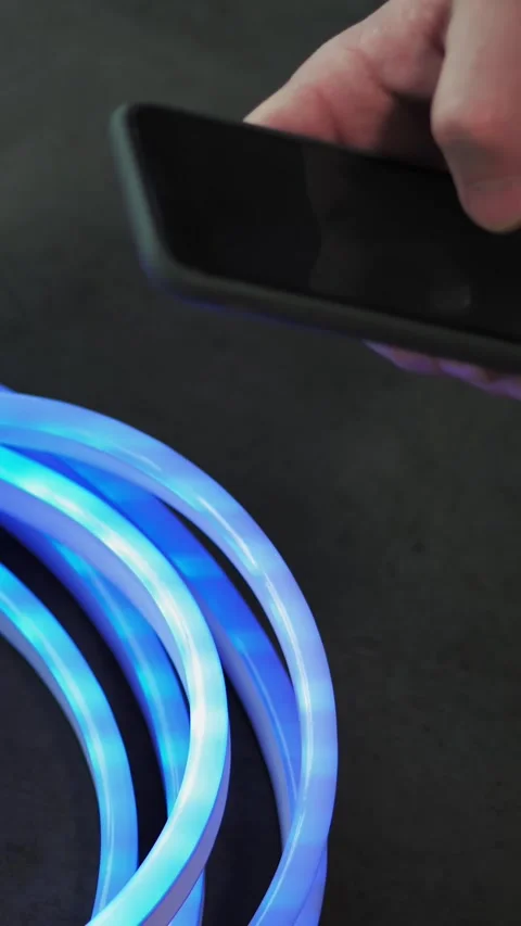 Led strip. close-up. neon tape, lamp. Controlling lighting device with an app in Stock-Footage 319390184