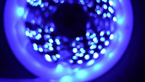 Led strip coil closeup. Diode shining stripe on dark blue background. Stock Footage 113009766