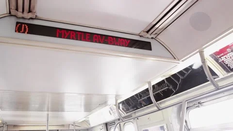Led subway sign changing time and station in a clean wagon Stock Footage 136204972