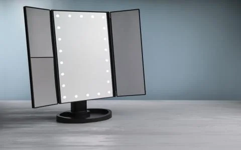 LED vanity Make up mirror on white table with blue background. Stock Photos