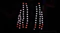 LED vest lights up while being worn during festival - 1 HD Footage
