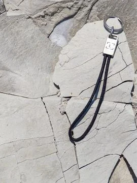 Ledger keychain on the fossilized seabed texture at White Rocks landmark, Byala. Stock Photos