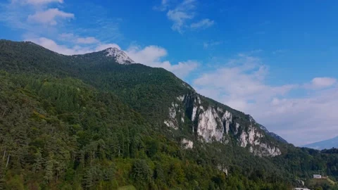 Ledro mountain landscape featuring forest, sky, and rocky cliffs. aerial Video stock 333207402