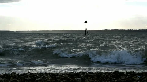 Lee-on-the-Solent waves breaking on stoney beach and groyne in sea Stock Footage 45591525