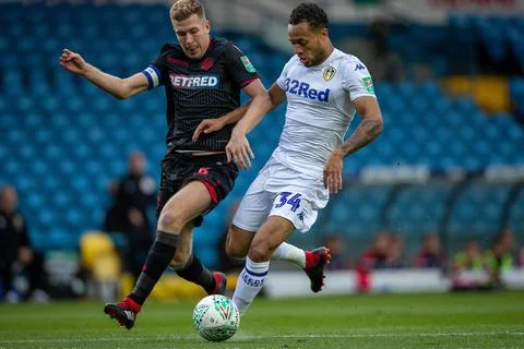 Leeds Utd's Lewis Baker And Bolton's Josh Vela In The Efl Cup. Efl Cup 1st Rnd:  Stock Photos