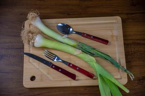 Leek on cutting board Stock Photos