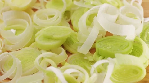 Leek onion macro close up. Leek onion stem and pieces close up. Fresh food Stock Footage 247141344