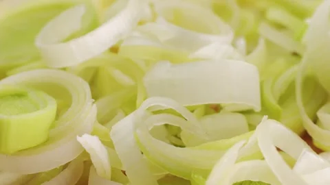 Leek onion macro close up. Leek onion stem and pieces close up. Fresh food Stock Footage 264696547