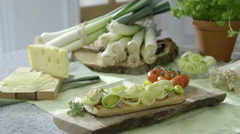 Leeks recipe display on kitchen worktop dolly in Video stock 63780010