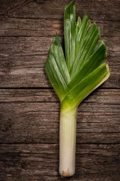 Leeks on rustic background top view vertical Stock Photos