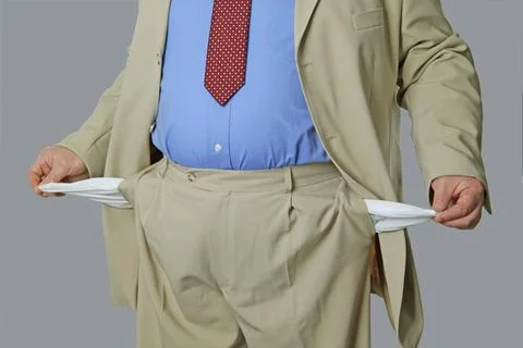  Leere Taschen Mann im Anzug mit leeren Taschen ,model released, Symbolfot... Stock Photos