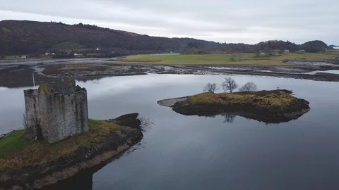 Left aerial pan over castle at lake Stock Footage 122216679