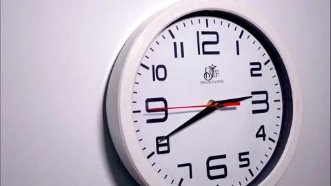Left-Angle Close-Up Time-Lapse of a White Wall Clock Stock Footage 337191427