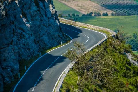 Left curve in the road of a mountains port Stock Photos