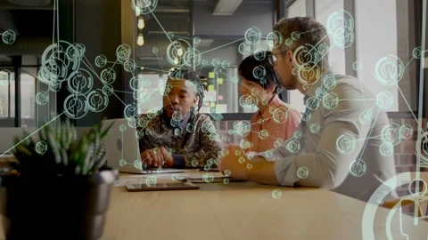 Left dev using laptop, starting network nodes and lines overlay, team pointing, Stock Footage 333477688