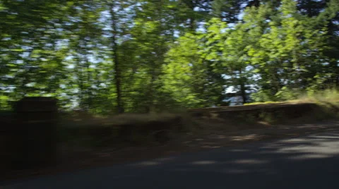 Left Front Three Quarter view of a Driving Plate: Car traveling east on Oregon's Stock Footage 59298651