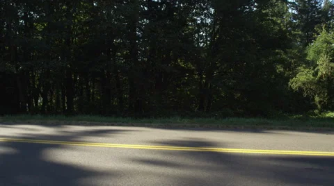 Left Front Three Quarter view of a Driving Plate: Car turns left from a parking Stock Footage 59299161