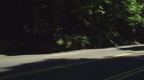 Left Front Three Quarter view of a Driving Plate: Car travels east on West Stock Footage 59303619