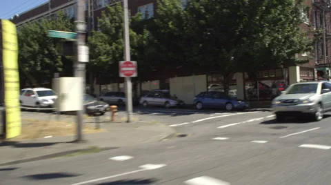 Left Front Three Quarter view of a Driving Plate: Car travels east on West Stock Footage 59304111