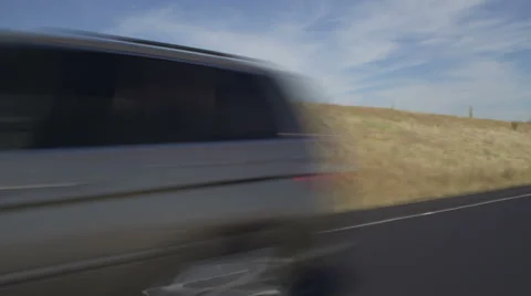 Left Front Three Quarter view of a Driving Plate: Car travels east along the Stock Footage 59313875