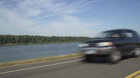 Left Front Three Quarter view of a Driving Plate: Car travels east on NE Marine Stock Footage 59314514