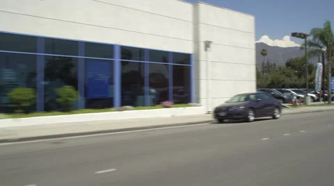 Left Front Three Quarter view of a Driving Plate: Car travels on East Foothill Stock Footage 59332764