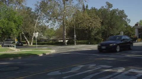 Left Front Three Quarter view of a Driving Plate: Car travels on Lake Avenue in Stock Footage 59333870