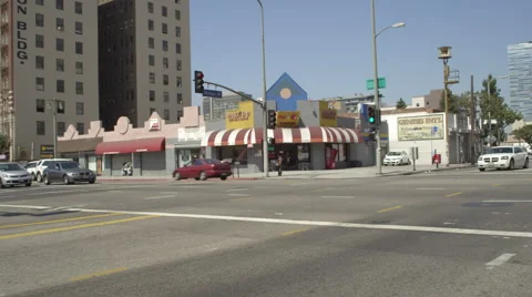 Left Front Three Quarter view of a Driving Plate: Car turns right from East Stock Footage 59335746