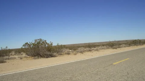 Left Front Three Quarter view of a Driving Plate; Car travels east on Shadow Stock Footage 59510350