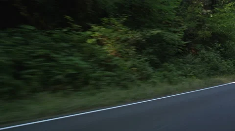 Left Front Three Quarter view of a Driving Plate: Car travels west on the Stock Footage 59510582
