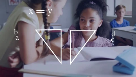 Left girl writing in school while triangle overlay appearing labeling note and Stock Footage 334368480