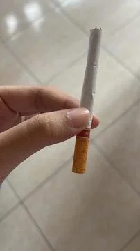 Left Hand Holding a Cigarette Stock Photos