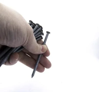 Left Hand Holding Nails Stock Photos