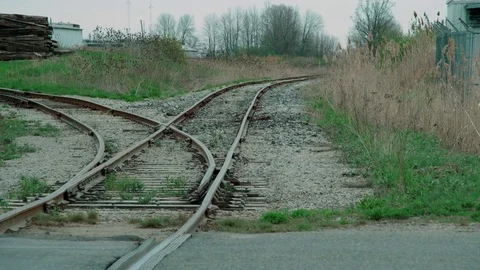 A left-hand railroad switch. Car passing by. Stock Footage 75286052
