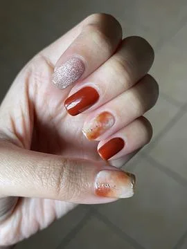 Left hand with stylish mixed-design manicure Stock-Fotos