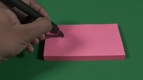 Left Hand Writing And Crossing Out 2020 On Pink Post It Note. Locked Off, Stock Footage 138182963