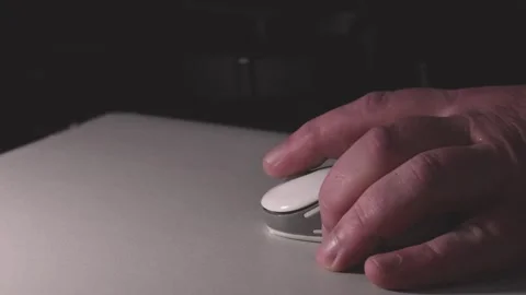 Left-handed man tries to control a computer mouse. changing the side of the.. Stock Footage 310495341
