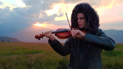 Left Handed Violin Player Practicing at Sunset Stock Footage 279398820