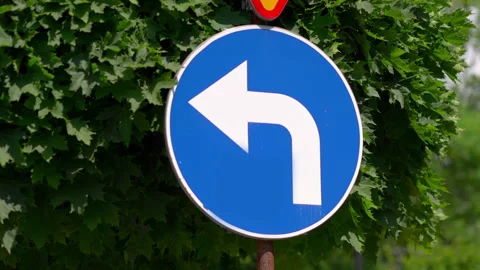 Left line must turn left sign in 4k slow motion 60fps Stock Footage 168537112