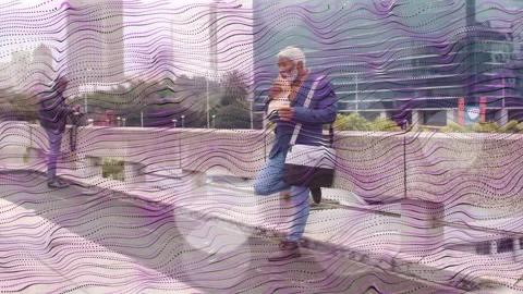 Left man framing with phone, directing right man walking ledge while eating, Stock Footage 333575482