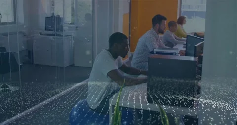 Left man typing at desk data updating and dot wave sweeping across desks, Video stock 331063099