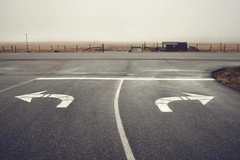 Left or right, roads intersection on a rainy day, USA. Stock Photos