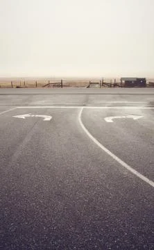Left or right, roads intersection on a rainy day, USA. Stock Photos