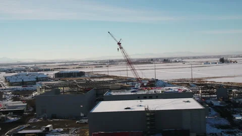 Left pan aerial of a crane on a construction project Stock Footage 284966924