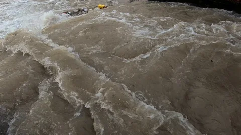 Left pan dirty rainfall water leaving small concrete canal Stock Footage 120354045